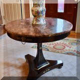 F02. Marble top pedestal table. 30”h x 35”w 